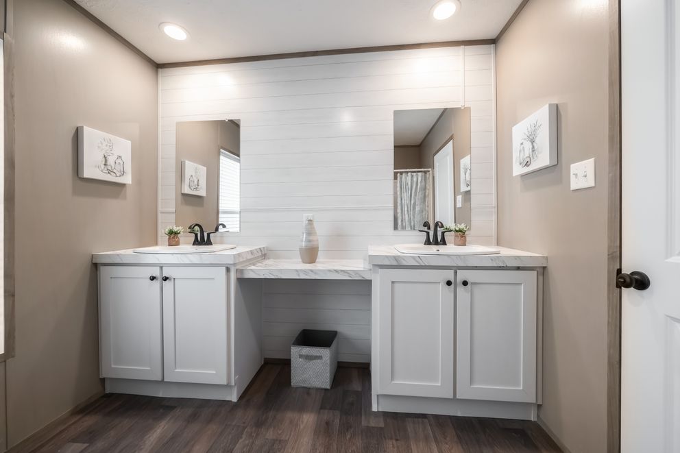 The FARMHOUSE BREEZE 72 Guest Bathroom. This Manufactured Mobile Home features 4 bedrooms and 2 baths.