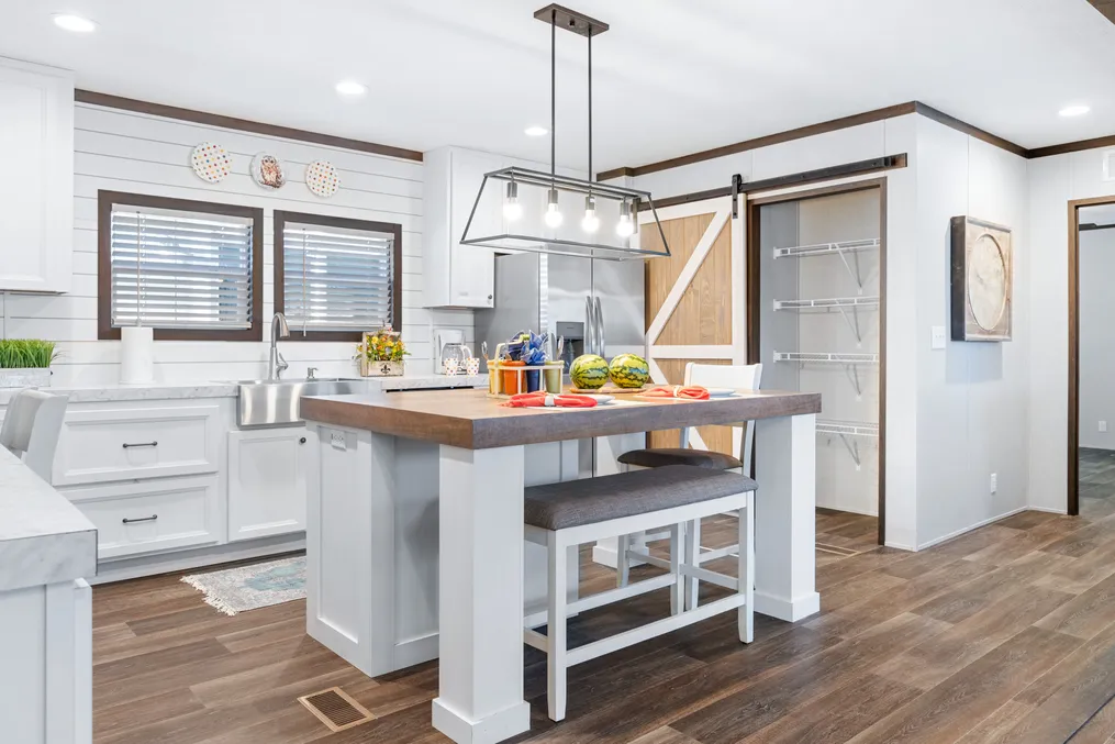 The BREEZE FARMHOUSE 72 Kitchen. This Manufactured Mobile Home features 4 bedrooms and 2 baths.