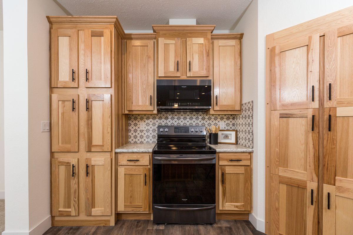 The LEGACY 412 Kitchen. This Manufactured Mobile Home features 3 bedrooms and 2 baths.