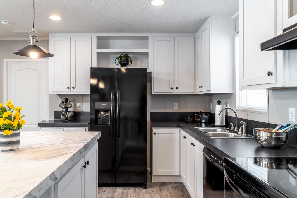 The TRADITION 48 Kitchen. This Manufactured Mobile Home features 3 bedrooms and 2 baths.