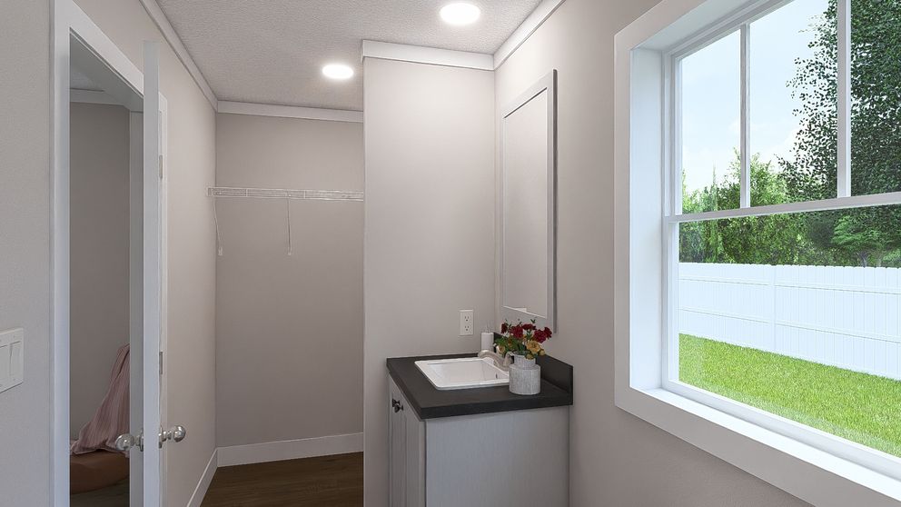 The MOVE ON UP Guest Bathroom. This Manufactured Mobile Home features 3 bedrooms and 2 baths.
