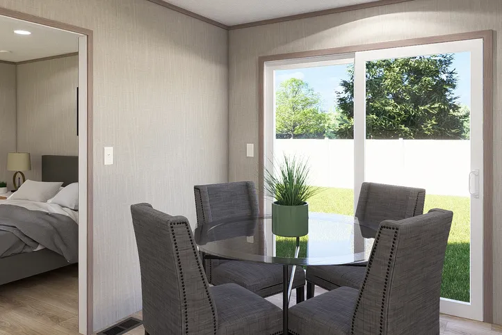 The ULTRA A-PLUS 16X76 Dining Room. This Manufactured Mobile Home features 3 bedrooms and 2 baths.