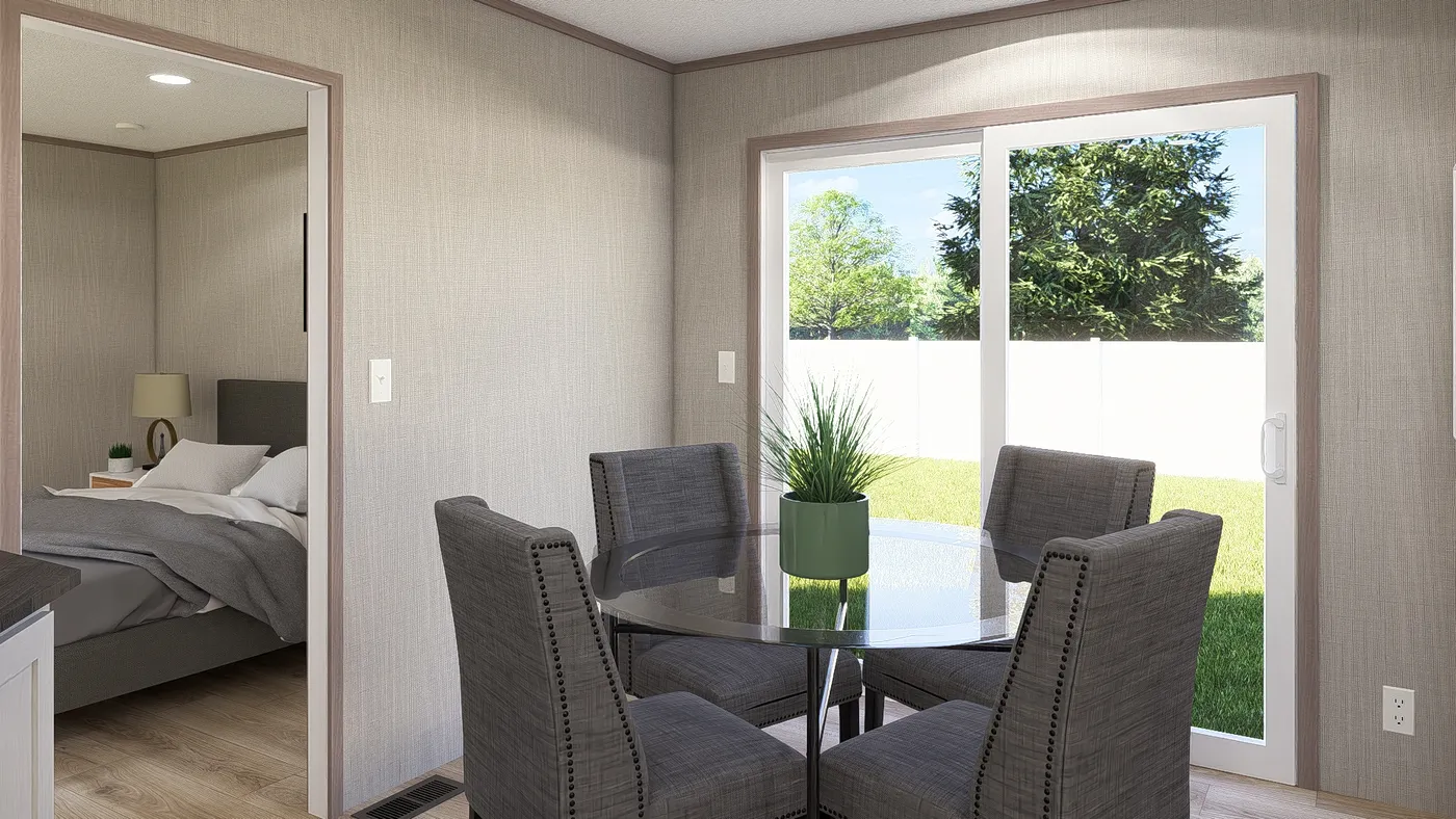 The ULTRA A-PLUS 16X76 Dining Room. This Manufactured Mobile Home features 3 bedrooms and 2 baths.