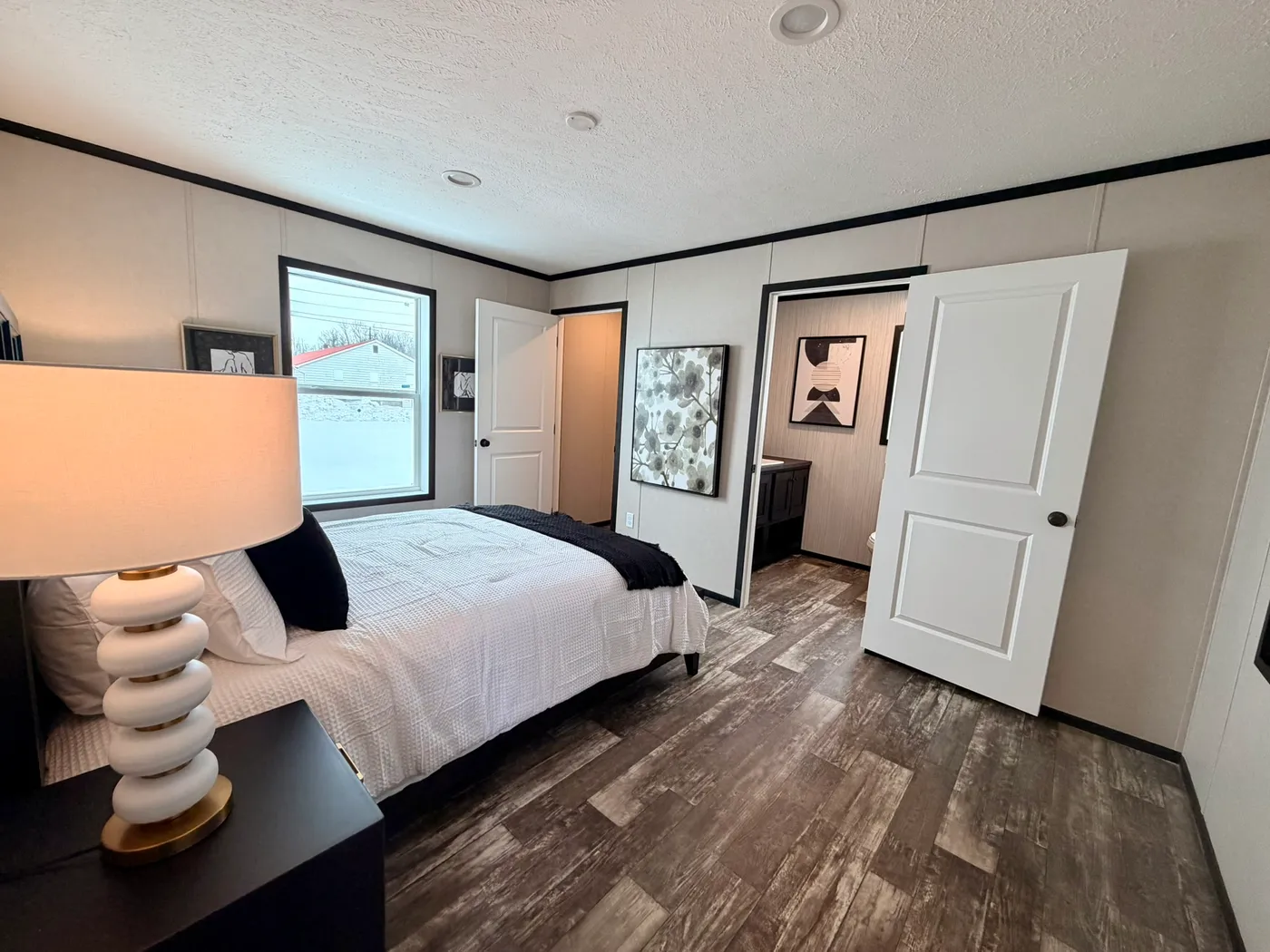 The PEARL Primary Bedroom. This Manufactured Mobile Home features 3 bedrooms and 2 baths.