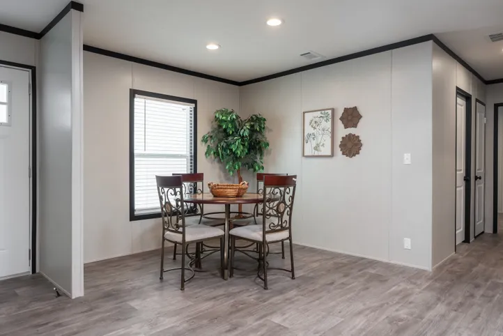 The BREEZE FARMHOUSE Dining Area. This Manufactured Mobile Home features 3 bedrooms and 2 baths.