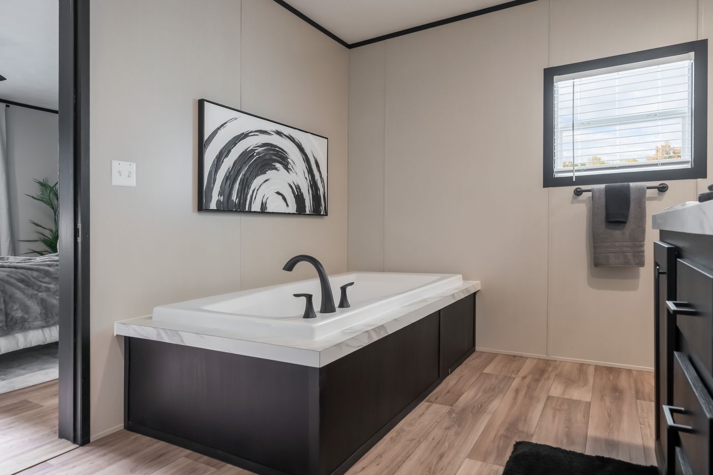 The THE ANNIVERSARY 2.1 Primary Bathroom. This Manufactured Mobile Home features 3 bedrooms and 2 baths.