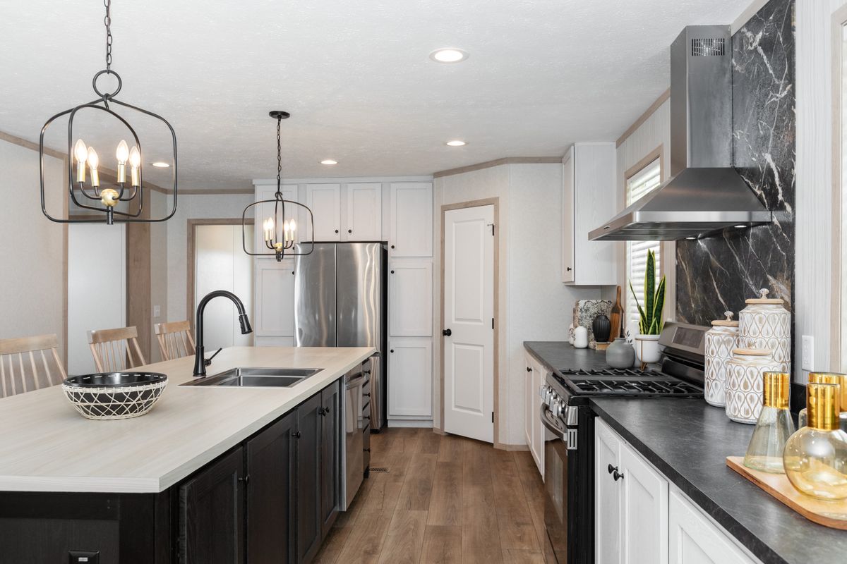 The 6032-5700 THE PULSE Kitchen. This Manufactured Mobile Home features 3 bedrooms and 2 baths.