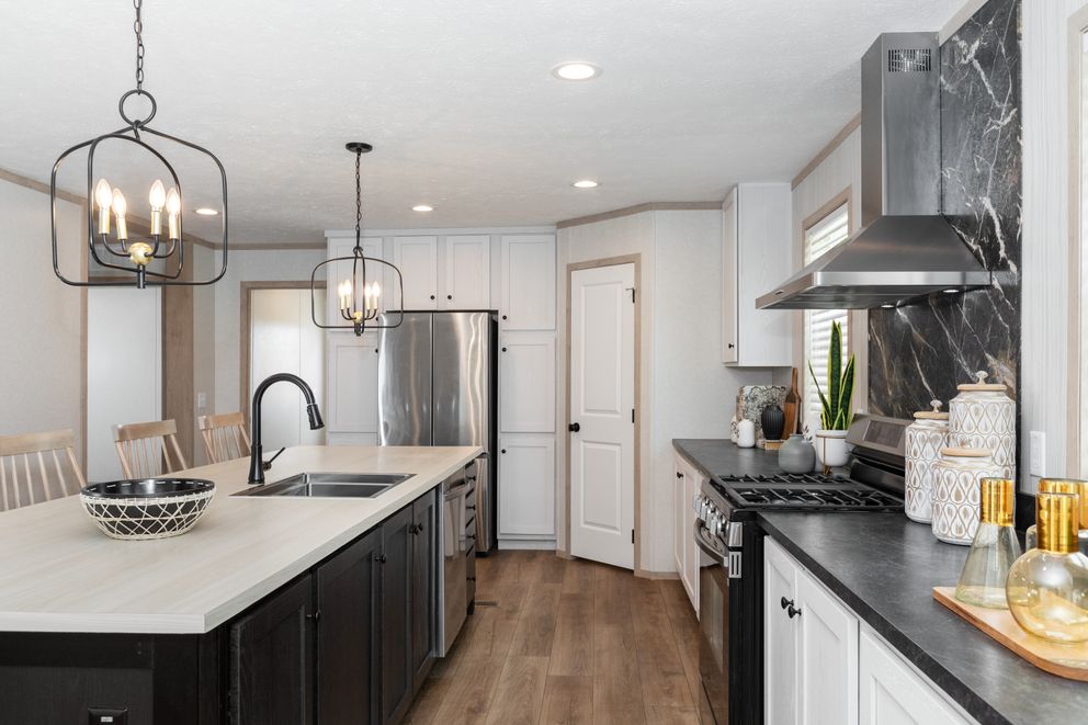 The 6032-5700 THE PULSE Kitchen. This Manufactured Mobile Home features 3 bedrooms and 2 baths.