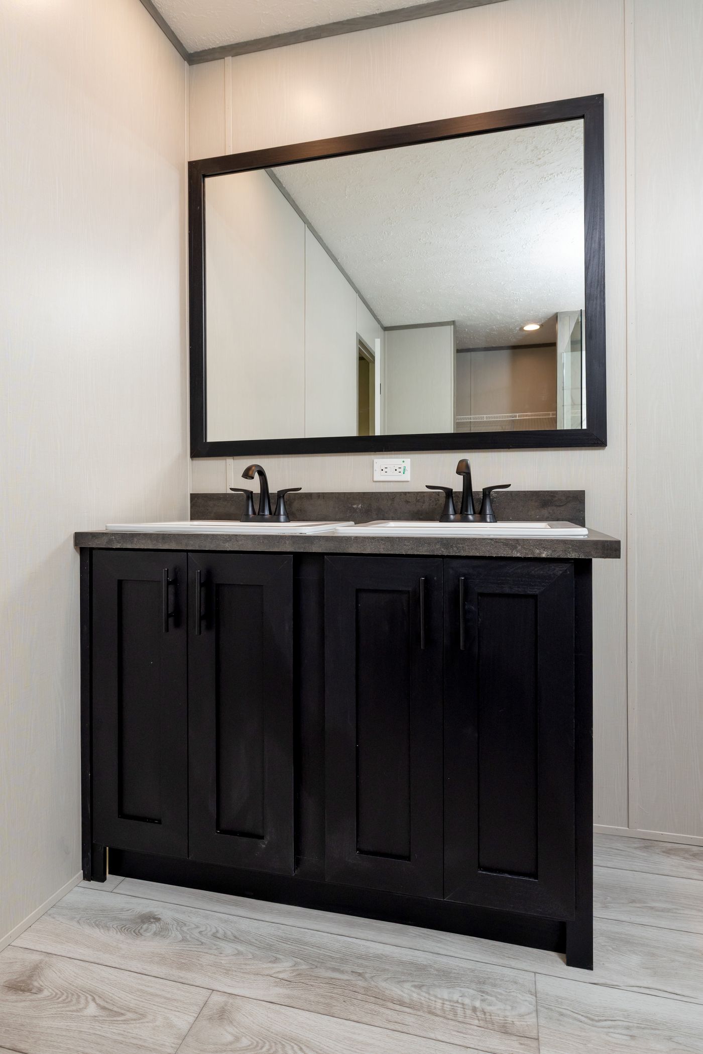 The SHOWER HOUSE Primary Bathroom. This Manufactured Mobile Home features 3 bedrooms and 2 baths.
