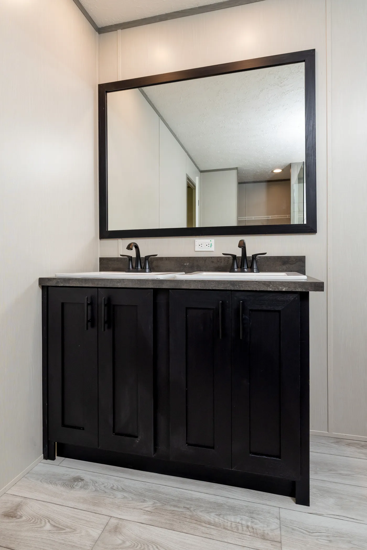 The SHOWER HOUSE Primary Bathroom. This Manufactured Mobile Home features 3 bedrooms and 2 baths.