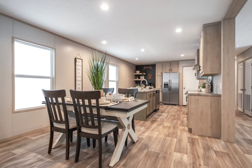The RAINIER Dining Area. This Manufactured Mobile Home features 4 bedrooms and 3 baths.