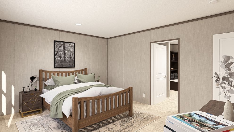 The ULTRA PRO 3 BR 28X60 Primary Bedroom. This Manufactured Mobile Home features 3 bedrooms and 2 baths.