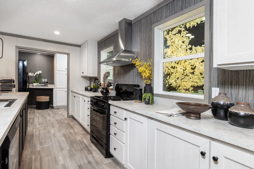 The 6428-E792 THE PULSE Kitchen. This Manufactured Mobile Home features 3 bedrooms and 2.5 baths.