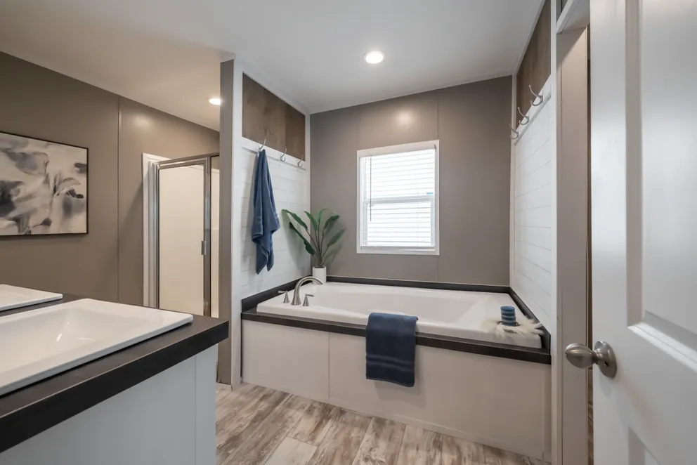 The LIBERTY Primary Bathroom. This Manufactured Mobile Home features 3 bedrooms and 2 baths.