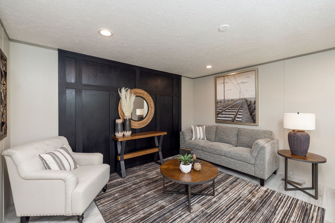The SHOWER HOUSE Living Room. This Manufactured Mobile Home features 3 bedrooms and 2 baths.