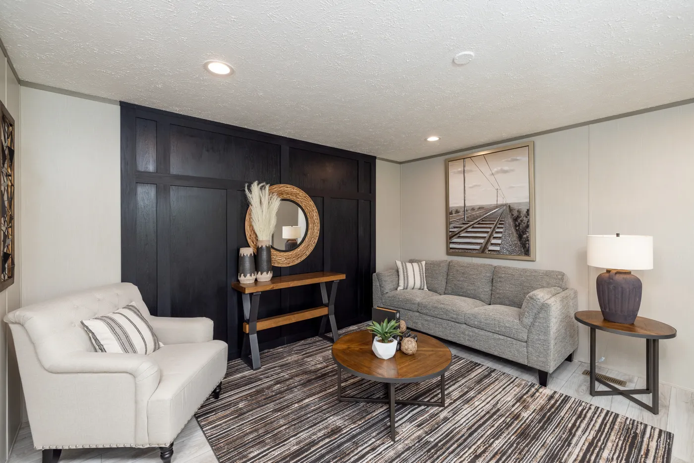 The SHOWER HOUSE Living Room. This Manufactured Mobile Home features 3 bedrooms and 2 baths.