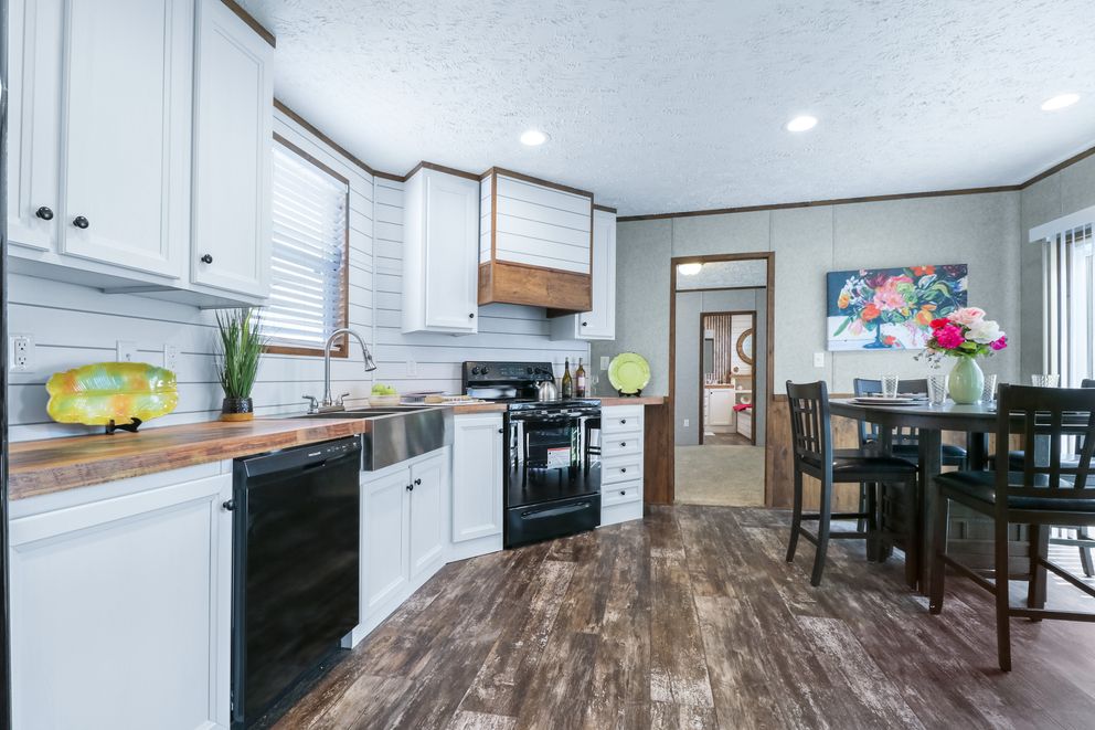The ANNIVERSARY ENTERTAINER Exterior. This Manufactured Mobile Home features 3 bedrooms and 2 baths.