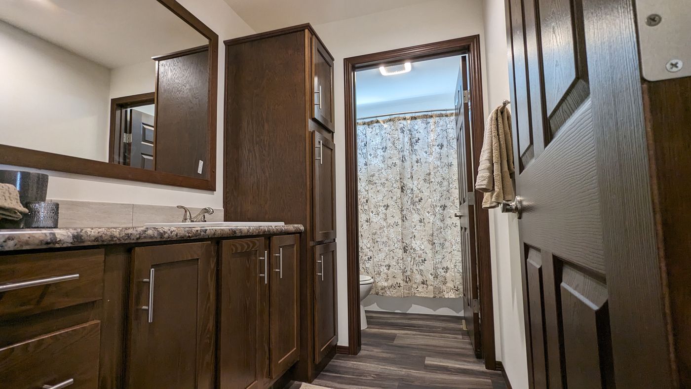 The LEGEND 327-1 Guest Bathroom. This Manufactured Mobile Home features 3 bedrooms and 2 baths.