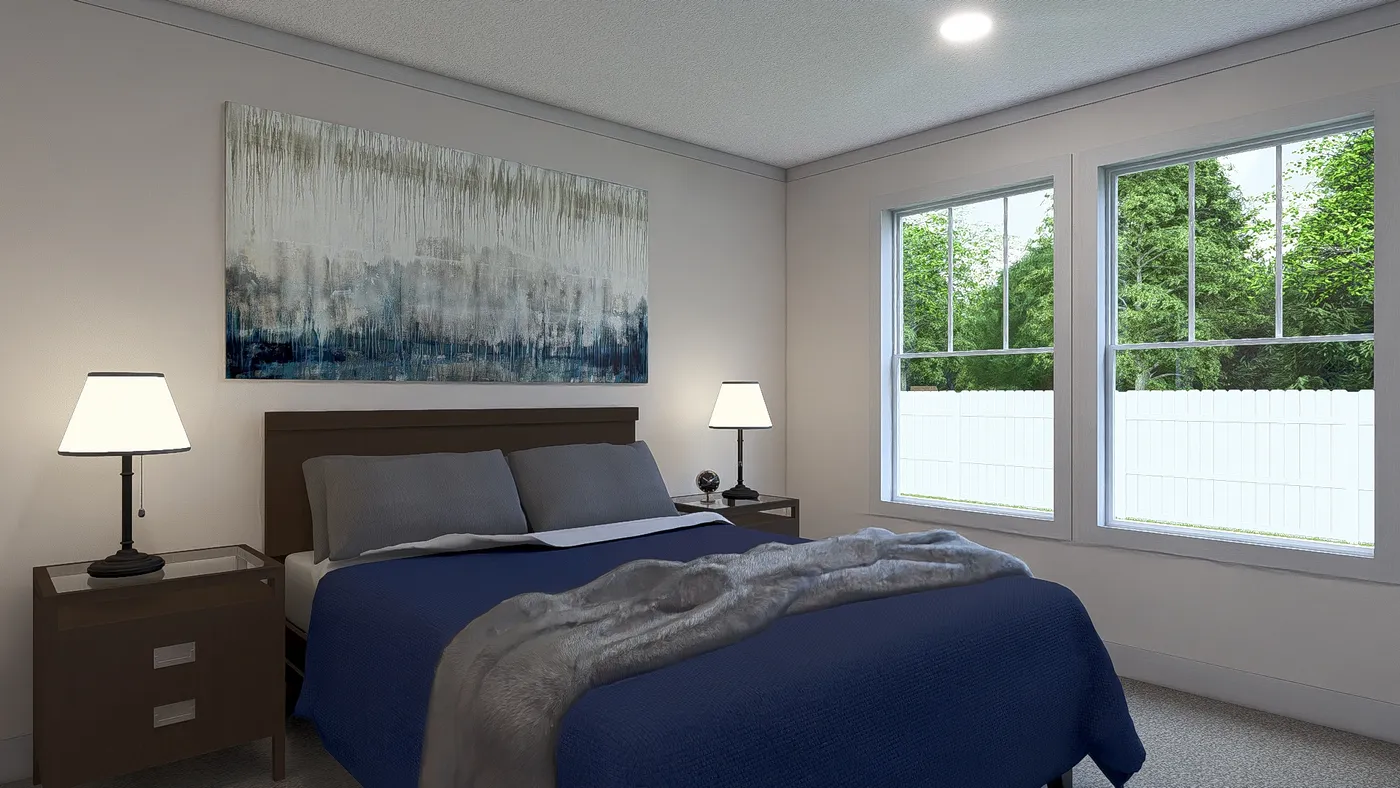 The JOHNNY B GOODE Primary Bedroom. This Manufactured Mobile Home features 3 bedrooms and 2 baths.