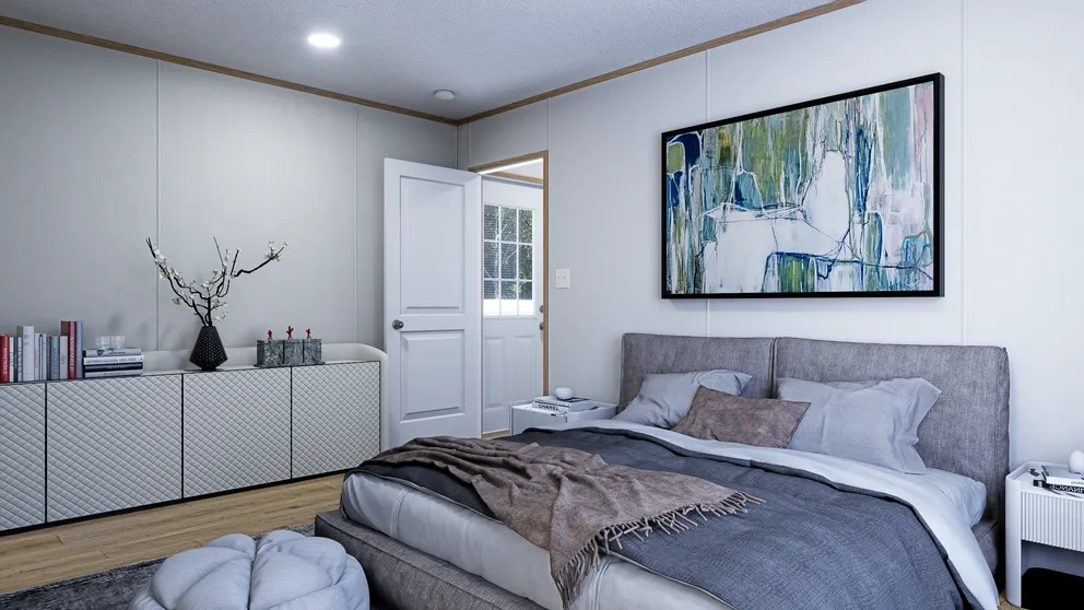The EMBER Primary Bedroom. This Manufactured Mobile Home features 2 bedrooms and 2 baths.