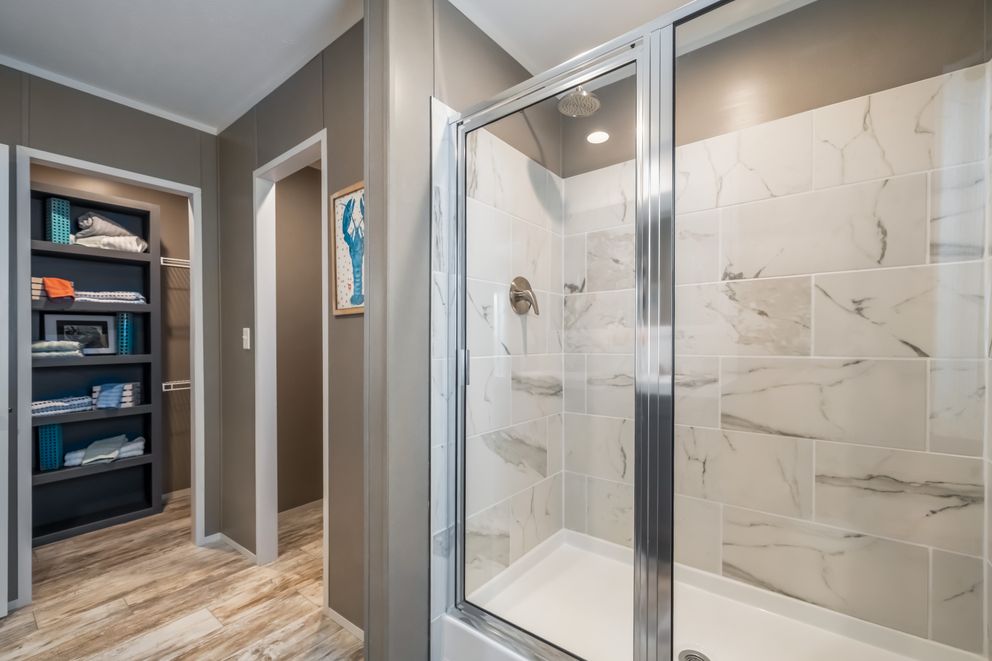 The THE DRIFTWOOD Primary Bathroom. This Manufactured Mobile Home features 3 bedrooms and 2 baths.
