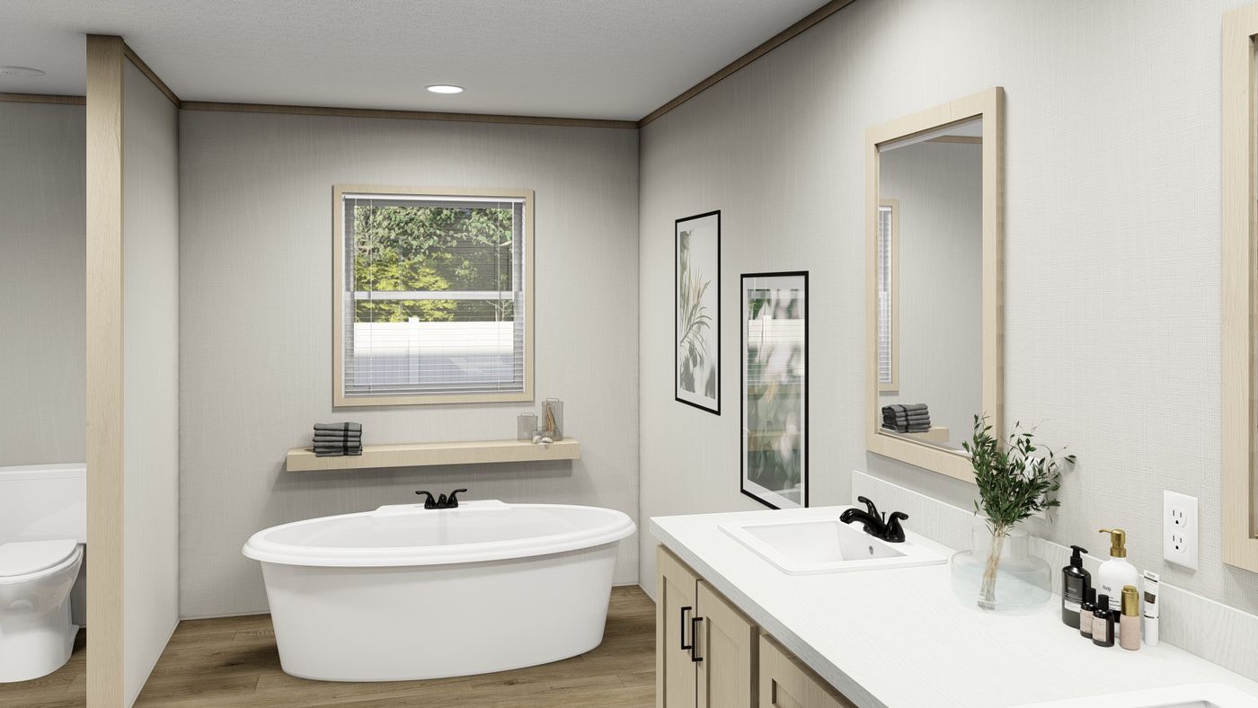 The KING AIR Primary Bathroom. This Manufactured Mobile Home features 4 bedrooms and 2 baths.