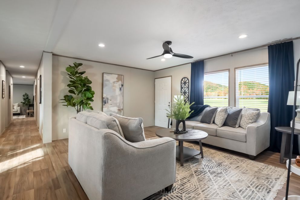 The ECLIPSE Living Room. This Manufactured Mobile Home features 4 bedrooms and 2 baths.