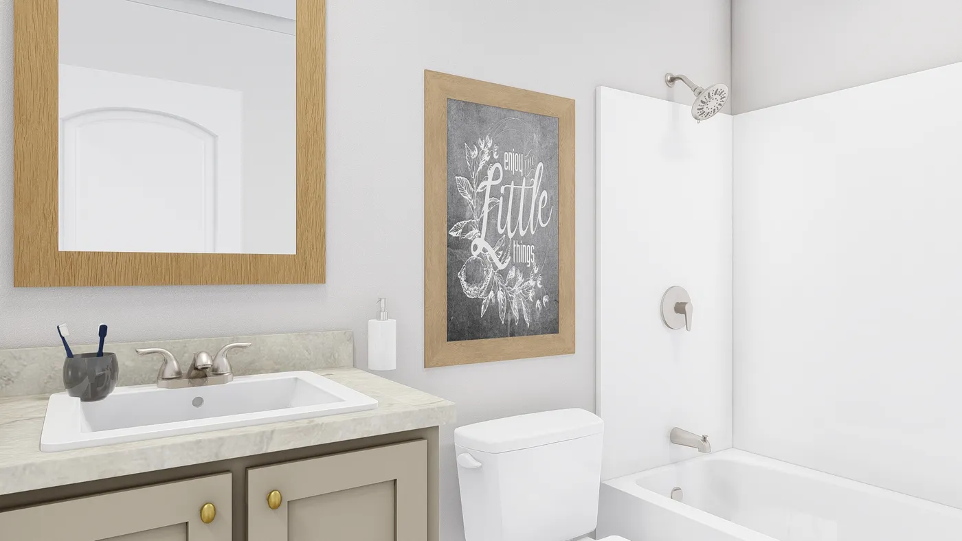 The STAYIN' ALIVE Guest Bathroom. This Manufactured Mobile Home features 3 bedrooms and 2 baths.