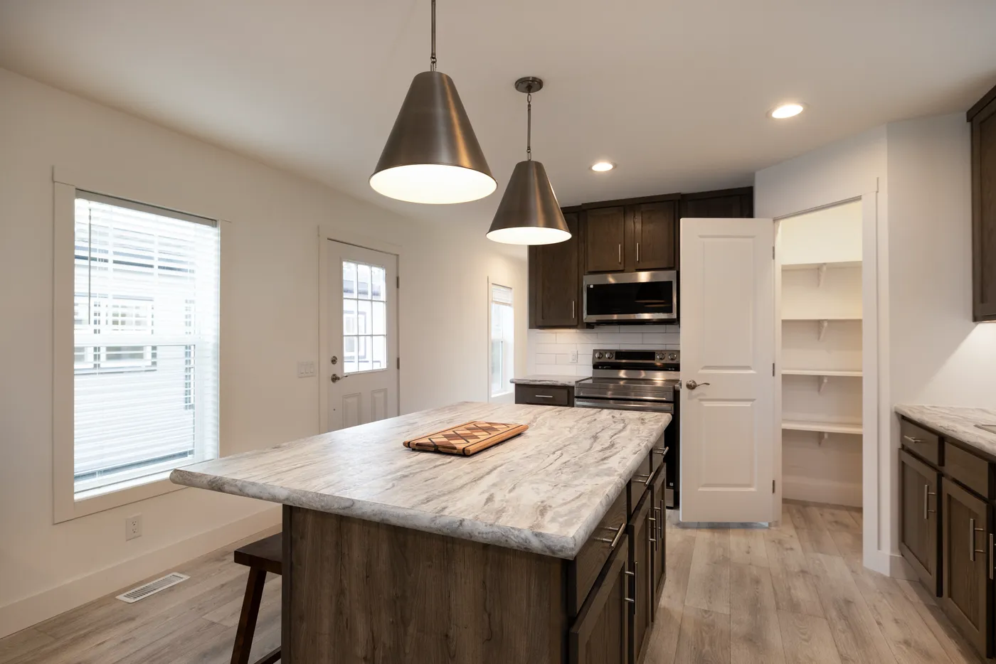 The RAMSEY 217-1 Kitchen. This Manufactured Mobile Home features 3 bedrooms and 2 baths.