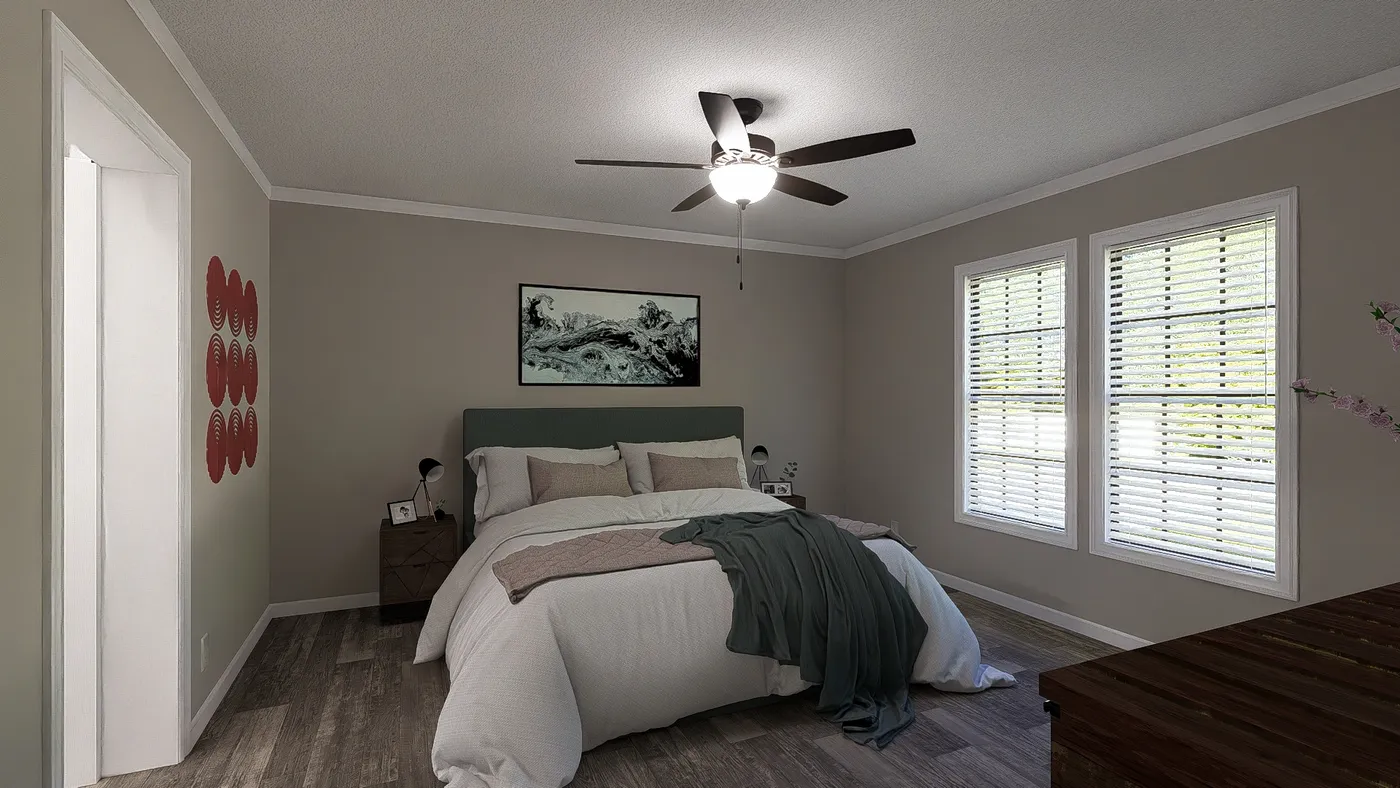 The THE LIL' EASY Primary Bedroom. This Manufactured Mobile Home features 3 bedrooms and 2 baths.
