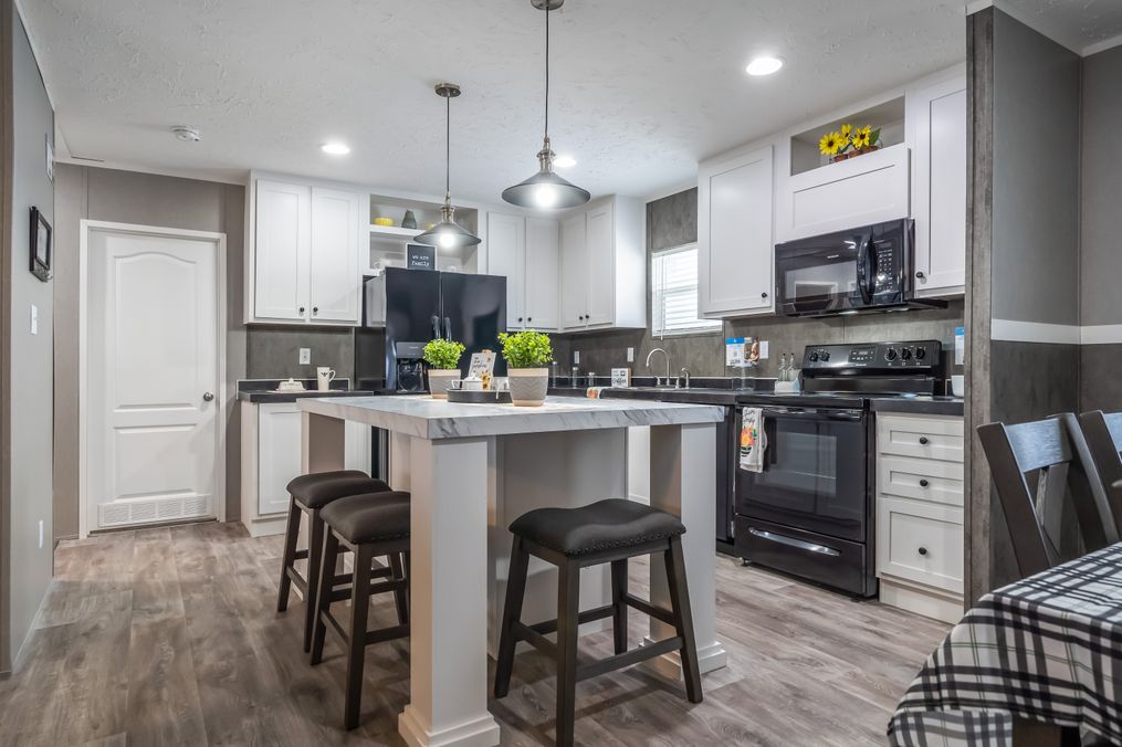 The TRADITION 48 Kitchen. This Manufactured Mobile Home features 3 bedrooms and 2 baths.