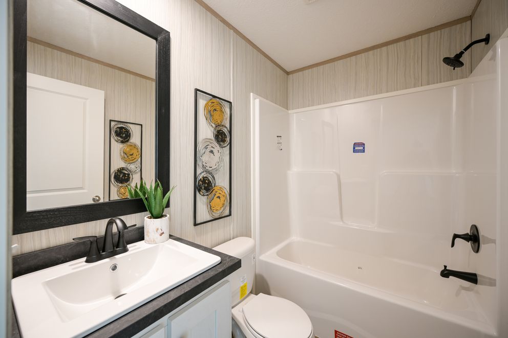 The TIGER'S EYE 7416-456 Guest Bathroom. This Manufactured Mobile Home features 3 bedrooms and 2 baths.