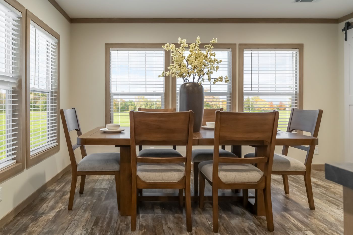 The BOUJEE PREMIER Dining Room. This Manufactured Mobile Home features 4 bedrooms and 2 baths.