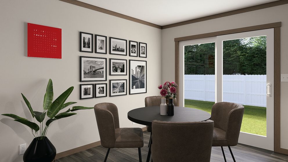 The LIZZIE ELITE Dining Room. This Manufactured Mobile Home features 3 bedrooms and 2 baths.