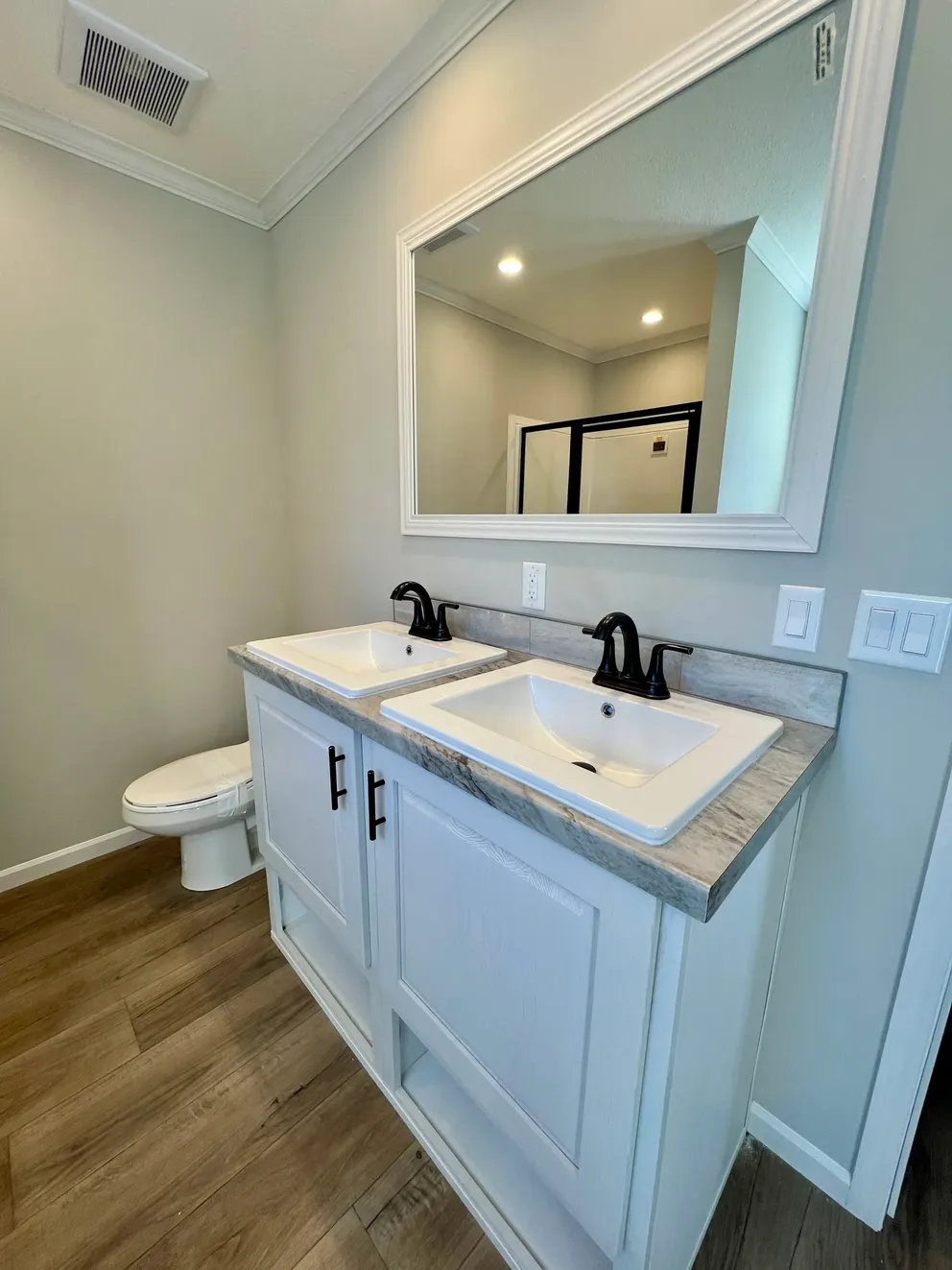 The THE TRUMAN Primary Bathroom. This Manufactured Mobile Home features 3 bedrooms and 2 baths.