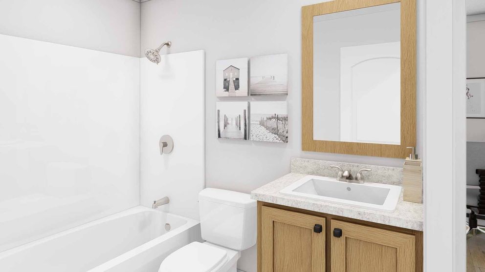The STILL THE ONE Guest Bathroom. This Manufactured Mobile Home features 2 bedrooms and 2 baths.