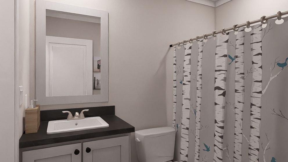 The STILL THE ONE Guest Bathroom. This Manufactured Mobile Home features 2 bedrooms and 2 baths.