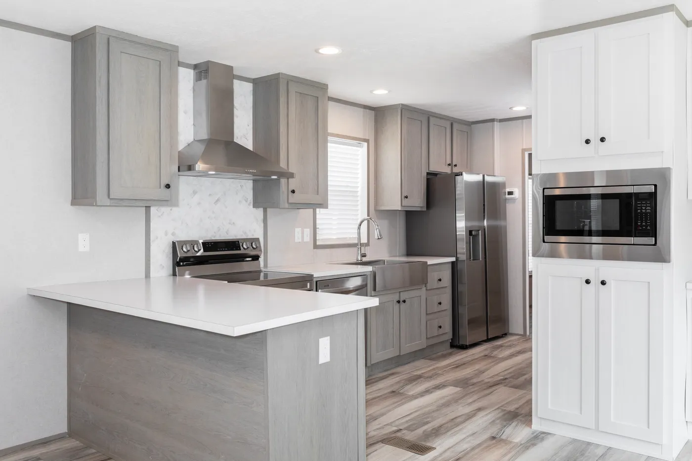 The THE OLYMPUS Kitchen. This Manufactured Mobile Home features 3 bedrooms and 2 baths.