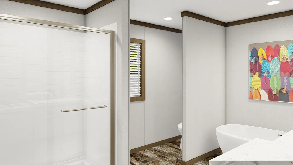 The HOMESTEAD BREEZE Primary Bathroom. This Manufactured Mobile Home features 4 bedrooms and 2 baths.