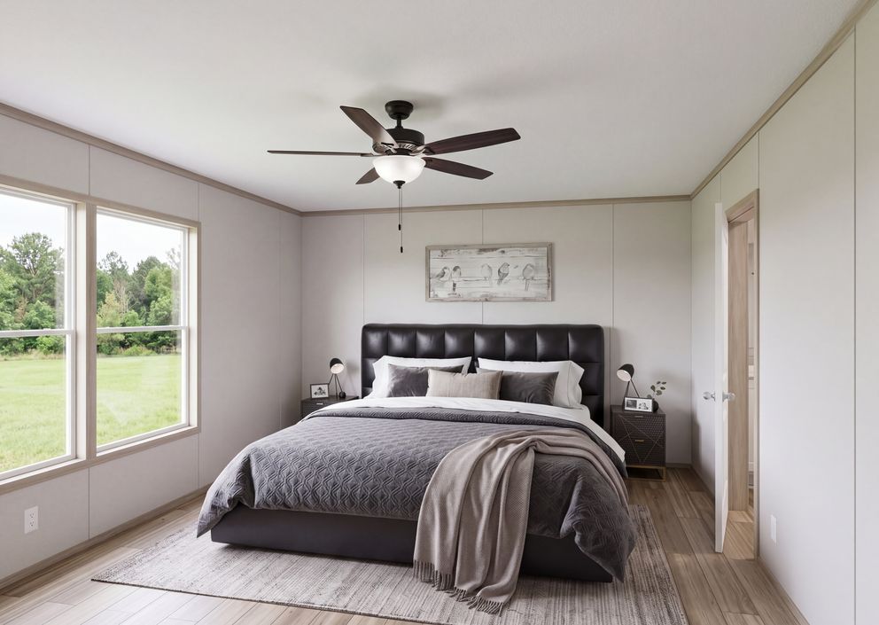 The THE MOUNTAINEER 76 Primary Bedroom. This Manufactured Mobile Home features 4 bedrooms and 2 baths.