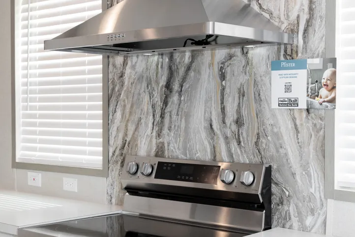 The PLATINUM ANNIVERSARY Kitchen. This Manufactured Mobile Home features 3 bedrooms and 2 baths.