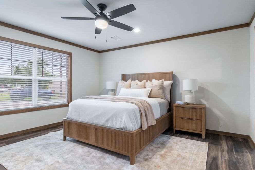 The EVERETT ELITE Primary Bedroom. This Manufactured Mobile Home features 4 bedrooms and 3 baths.