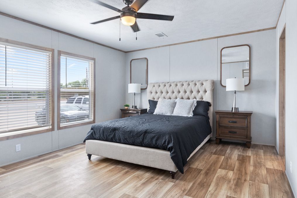 The EL SUENO BREEZE Primary Bedroom. This Manufactured Mobile Home features 4 bedrooms and 2 baths.