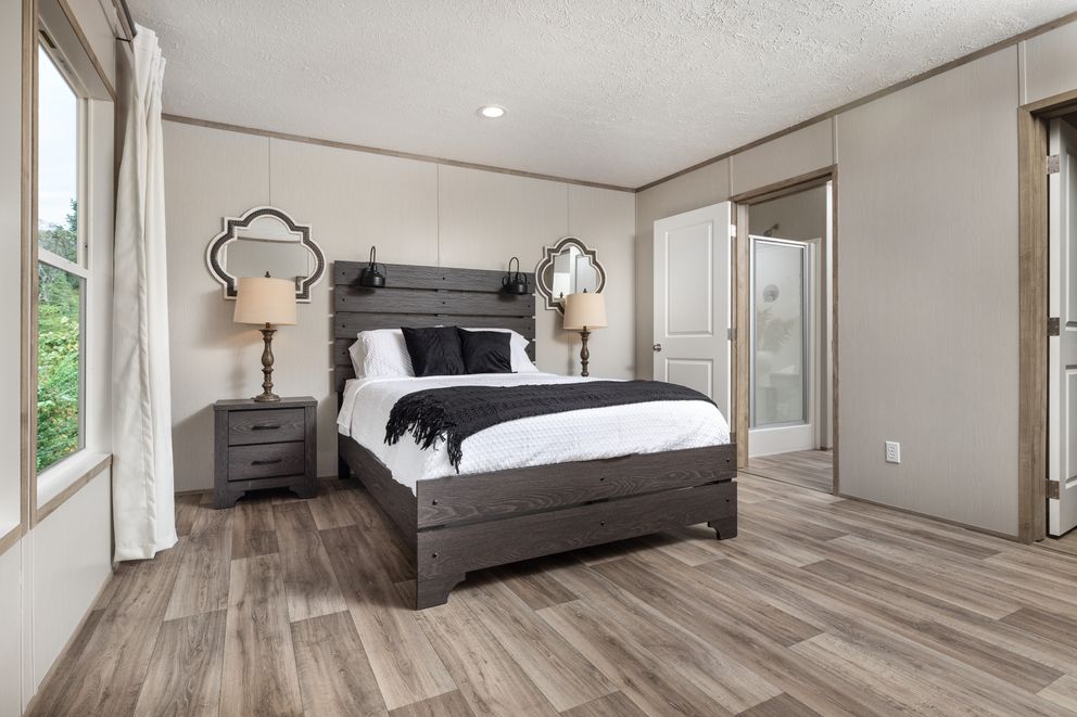 The ASPIRE Primary Bedroom. This Manufactured Mobile Home features 3 bedrooms and 2 baths.