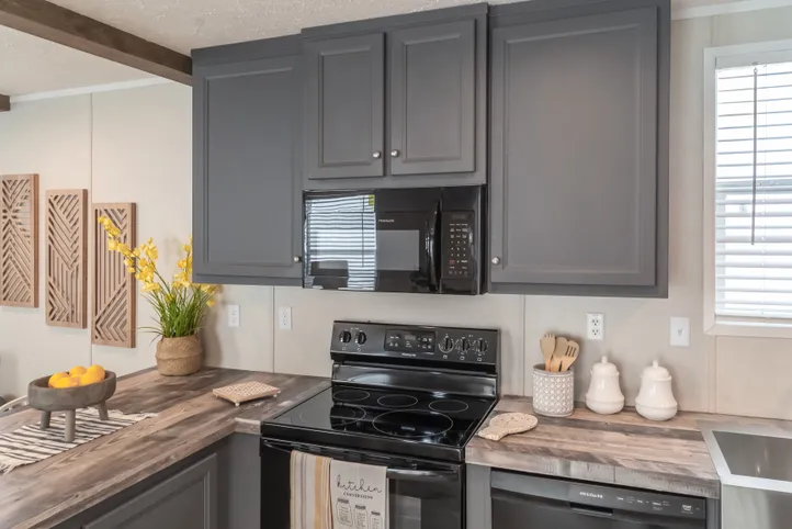 The ANNIVERSARY CHOICE Kitchen. This Manufactured Mobile Home features 3 bedrooms and 2 baths.