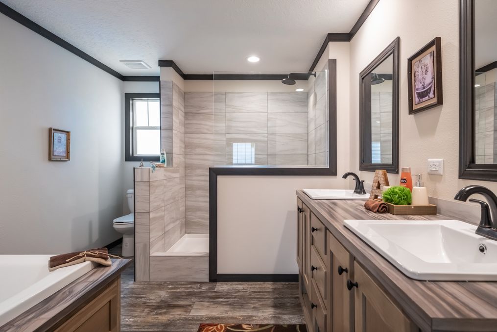 The BOUJEE 2 Primary Bathroom. This Manufactured Mobile Home features 3 bedrooms and 2 baths.