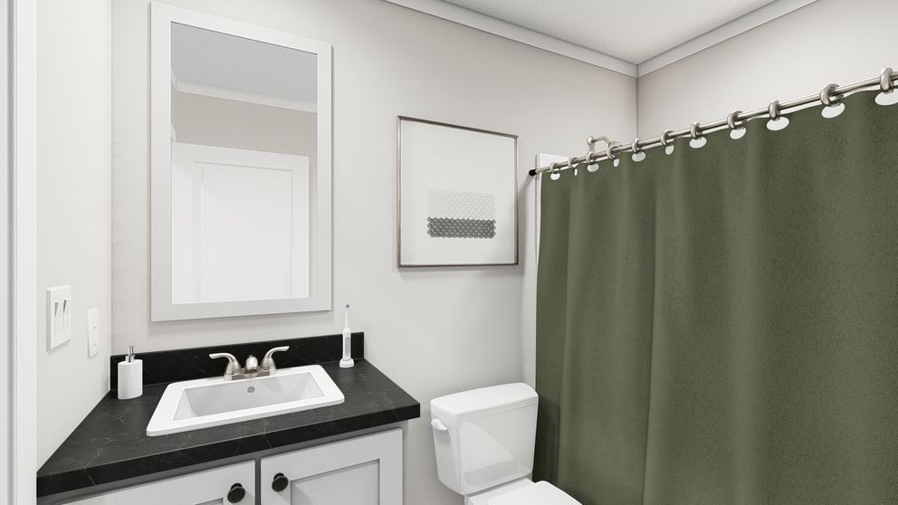 The UNDER PRESSURE Guest Bathroom. This Manufactured Mobile Home features 3 bedrooms and 2 baths.