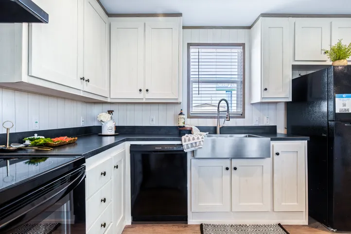 The PORCH LIVING SERIES 16682A Kitchen. This Manufactured Mobile Home features 2 bedrooms and 2 baths.