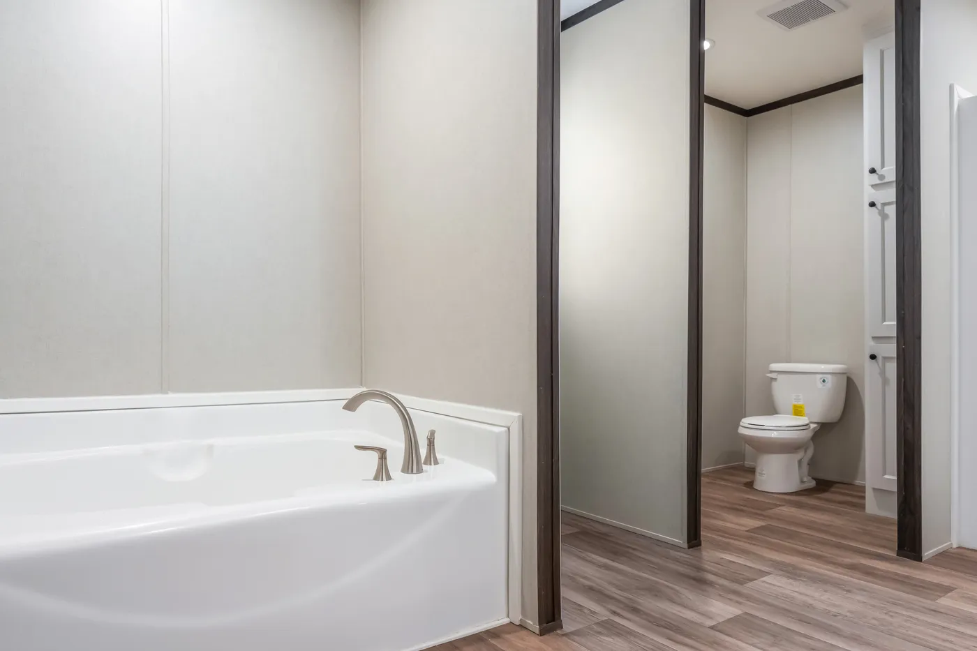 The EMPOWER Primary Bathroom. This Manufactured Mobile Home features 4 bedrooms and 2 baths.
