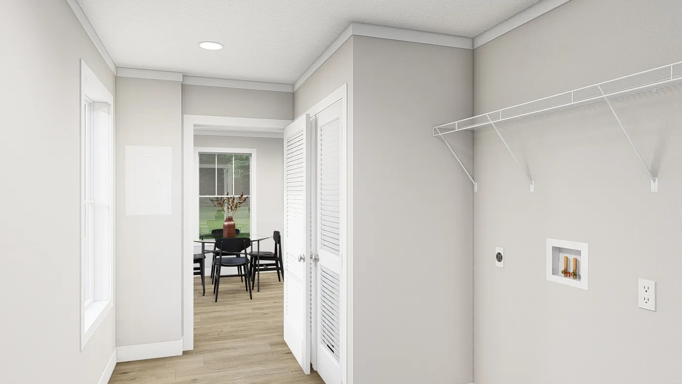 The HERE COMES THE SUN Utility Room. This Manufactured Mobile Home features 3 bedrooms and 2 baths.